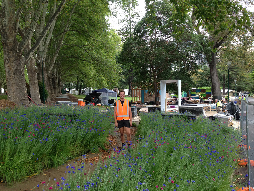 One of the dedicated Ian Barker Gardens construction team standing in the meadow at the 2015 Melbourne International Flower & Garden Show