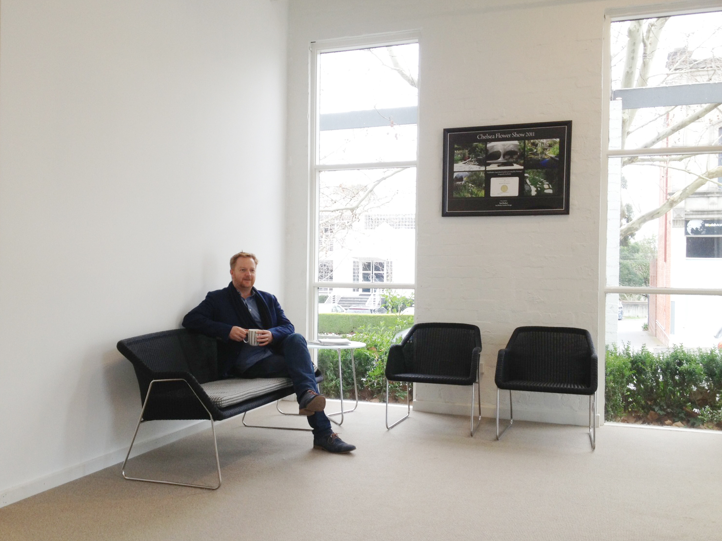 Ian testing out the new Mood 2 Seat Sofa in our waiting area at the new office in Canterbury