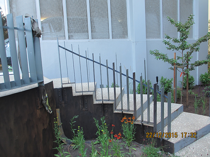 Concrete steps with steel edging and handrails ensure easy access through the garden at 28 Southgate Apartments designed and constructed by Ian Barker Gardens
