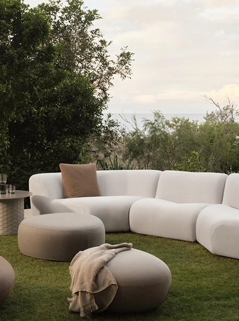 1977 Outdoor Sofa by King Living surrounded by greenery
