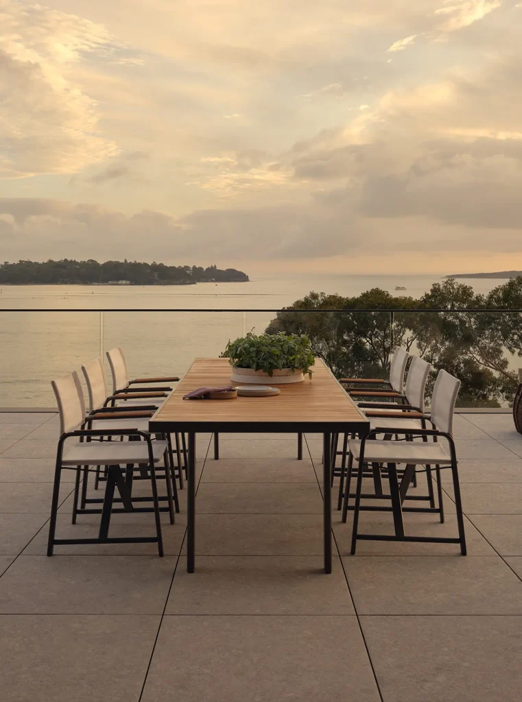 Plateau Outdoor Dining Table by King Living overlooking the water
