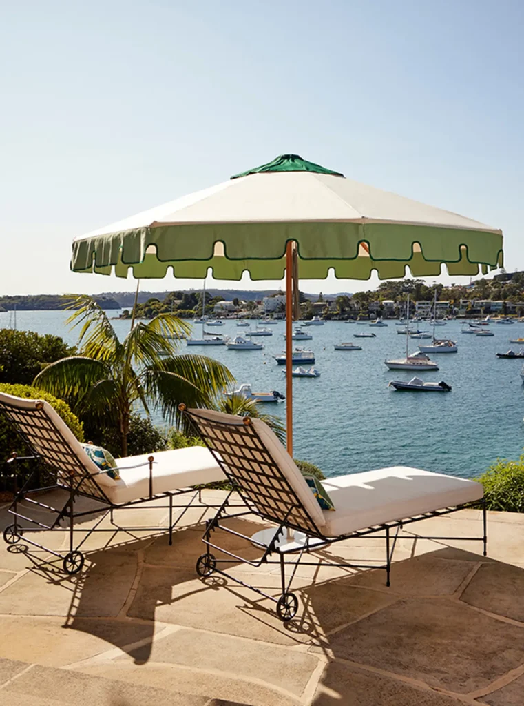 Sundial + Umbrella by Basil Bangs overlooking a bay
